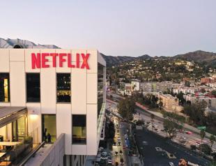Netflix soars to 230 mln subscribers, co-founder steps down