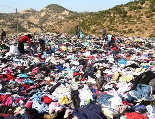 Piles of clothes for quake survivors left on roadside