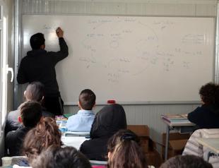 Teacher couple prepares quake-stricken students for exams in a container classroom