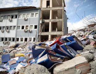 Lawyer stands guard over rubble