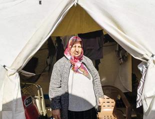 Quake survivor women deal with added burdens in tent cities