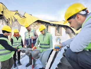 Experts, students volunteer to save historical artifacts from rubble