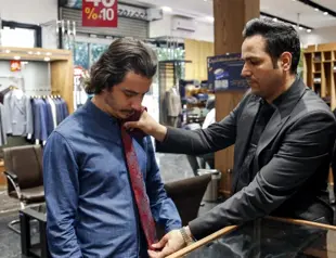 Once banned, Iran sees timid return of neckties