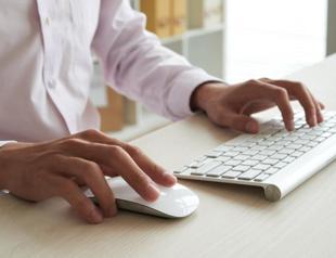 Typing and mouse clicks could detect office stress