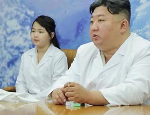 North Korea shows Kim Jong Un examining a military spy satellite