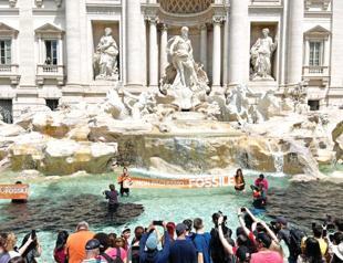 Climate activists turn Rome’s Trevi Fountain black