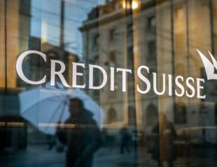 UBS delays results over Credit Suisse merger
