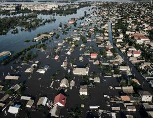 Russia shells Ukrainian city inundated by dam collapse