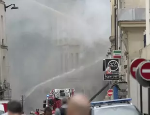 Paris police look at gas leak as possible cause of explosion and fire that injured 24