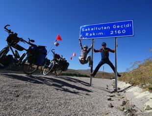 French couple on bikes pass by Erzincan