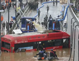 7 bodies pulled from flooded road tunnel in S Korea as rains cause flash floods, landslides