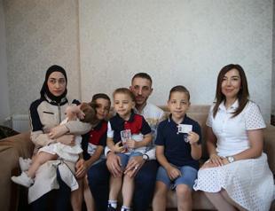 Family struggles to prove childs survival after quake mix-up