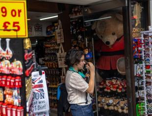 UK annual inflation drops under 8 percent