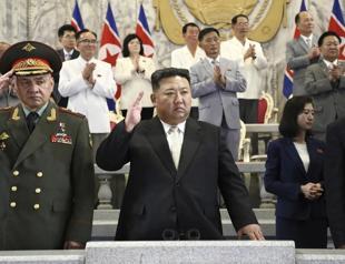 Russian, Chinese delegates join N Korean leader at parade showing newest missiles