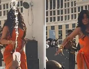 Rapper Cardi B, the target of a thrown liquid, retaliates