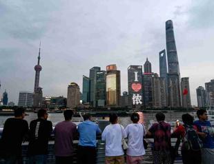 China relaxes visa, urban residency rules to boost economy