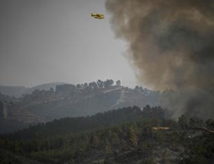 Temperatures soar in Iberia as wildfires force evacuation in Portugal