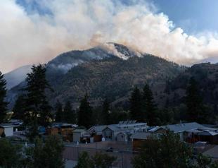 Wildfires threaten western Canada city as far north evacuated