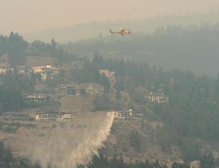 Western Canada wildfires force tens of thousands to flee