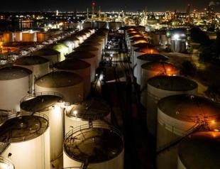 Oil prices spike as Saudi Arabia, Russia extend cut