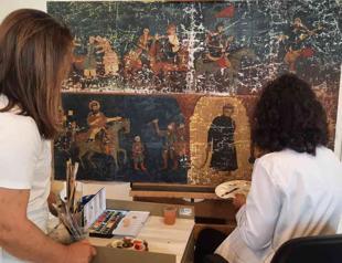 Expert team restores damaged historical artwork