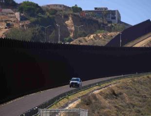 Biden to build more Mexico wall, says hands were tied