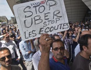French taxi drivers sue Uber over unfair competition