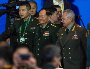 Top China, Russia officials warn foreign forces stoking turmoil