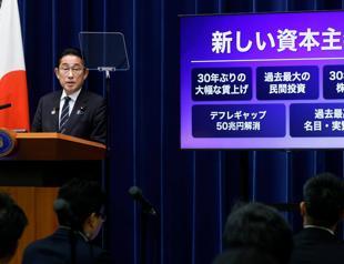 Japan PM unveils $113 bln stimulus as poll numbers slump