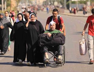 Israel pounds Gaza City as tens of thousands flee their homes