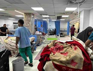 Heavy fighting rages near main Gaza hospital and people trapped inside say they cannot flee