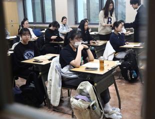 South Koreans sit key exam as flights halted to limit distraction