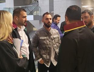 Bank manager in court for allegedly defrauding football players