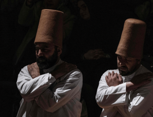 Tombstone hats remind whirling dervishes of their death