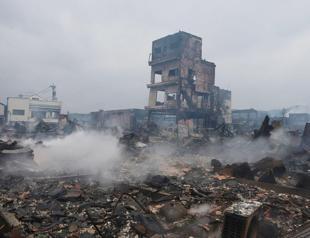 Japan quake toll rises to 64 as weather hampers rescuers