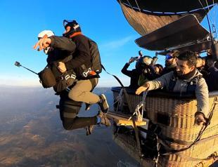 Parachutists leap from hot air balloons in tourism hotspot