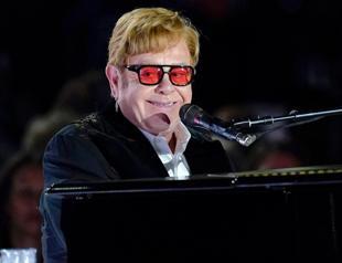 Boots, Banksy, piano: Elton John puts items up for auction