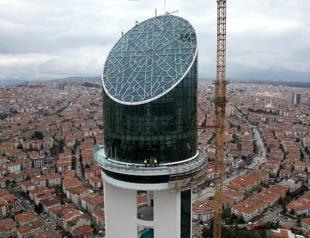 Climbers work on glass roof of Ankara Cumhuriyet Tower