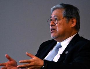 Philippines foreign minister urges China: stop harassing us