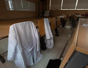 South Korean police question first doctor over walkouts