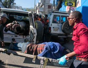 Bodies found in Haitian suburb as gang violence rages for third week