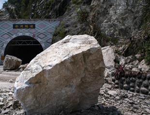 Helicopter plucks miners to safety as Taiwan searches for missing after quake