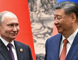 Putin in trade push on final day of China trip
