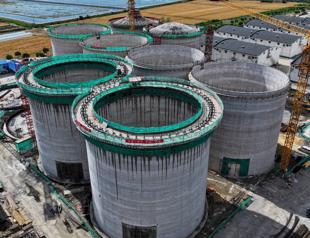 IMF lifts China growth forecast but warns on industrial policy