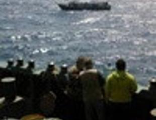 Italy starts transferring ashore migrants stranded on Turkish ship