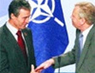 Rasmussen talks more moderately