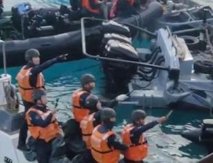 Chinese sailors wield sticks, axe in disputed sea clash with Philippines