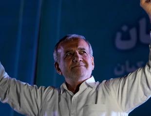 Calling for better ties with West, Iran reformist wins presidency