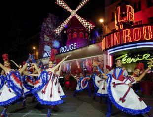 Pariss Moulin Rouge inaugurates new windmill sails ahead of Olympics