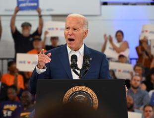 Biden defiant on campaign trail but pressure mounts